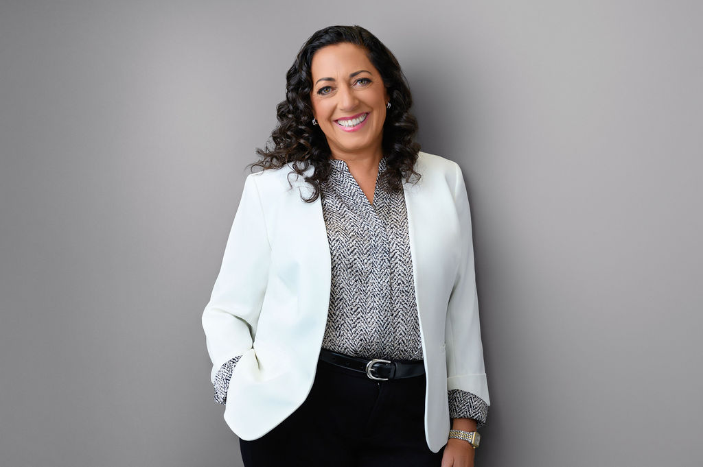 Professional branding photo of a senior leadership woman in a white blazer photographed in Central New Jersey